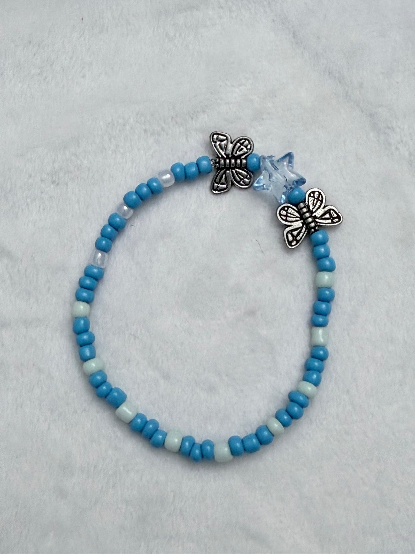 Blue seed bead bracelet with butterfly’s