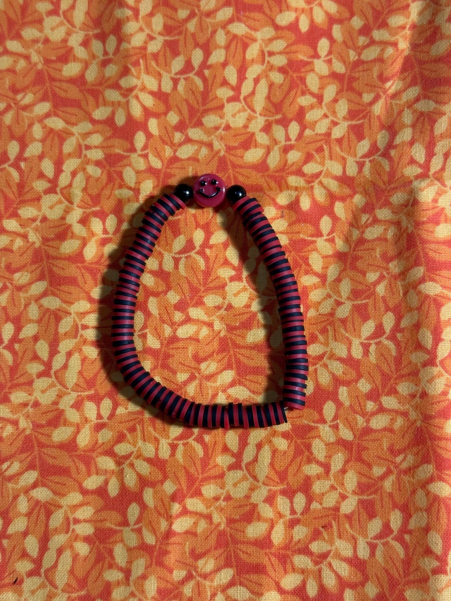 Red smiley face bracelet